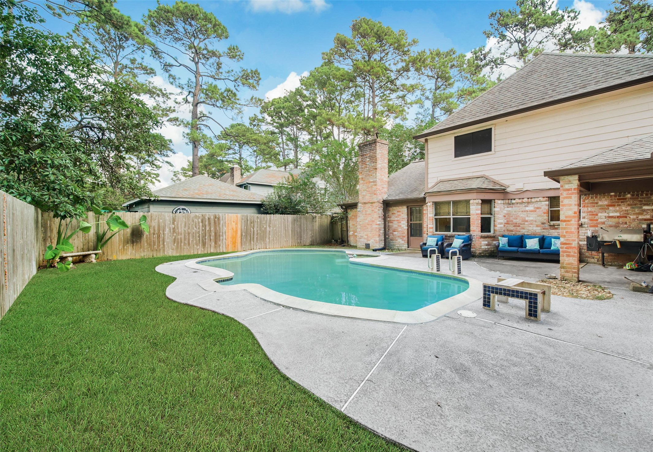 6522 Castle Pine Lane Spring, TX 77379 - Photo 36 of 38 a front view of a house with a garden and patio