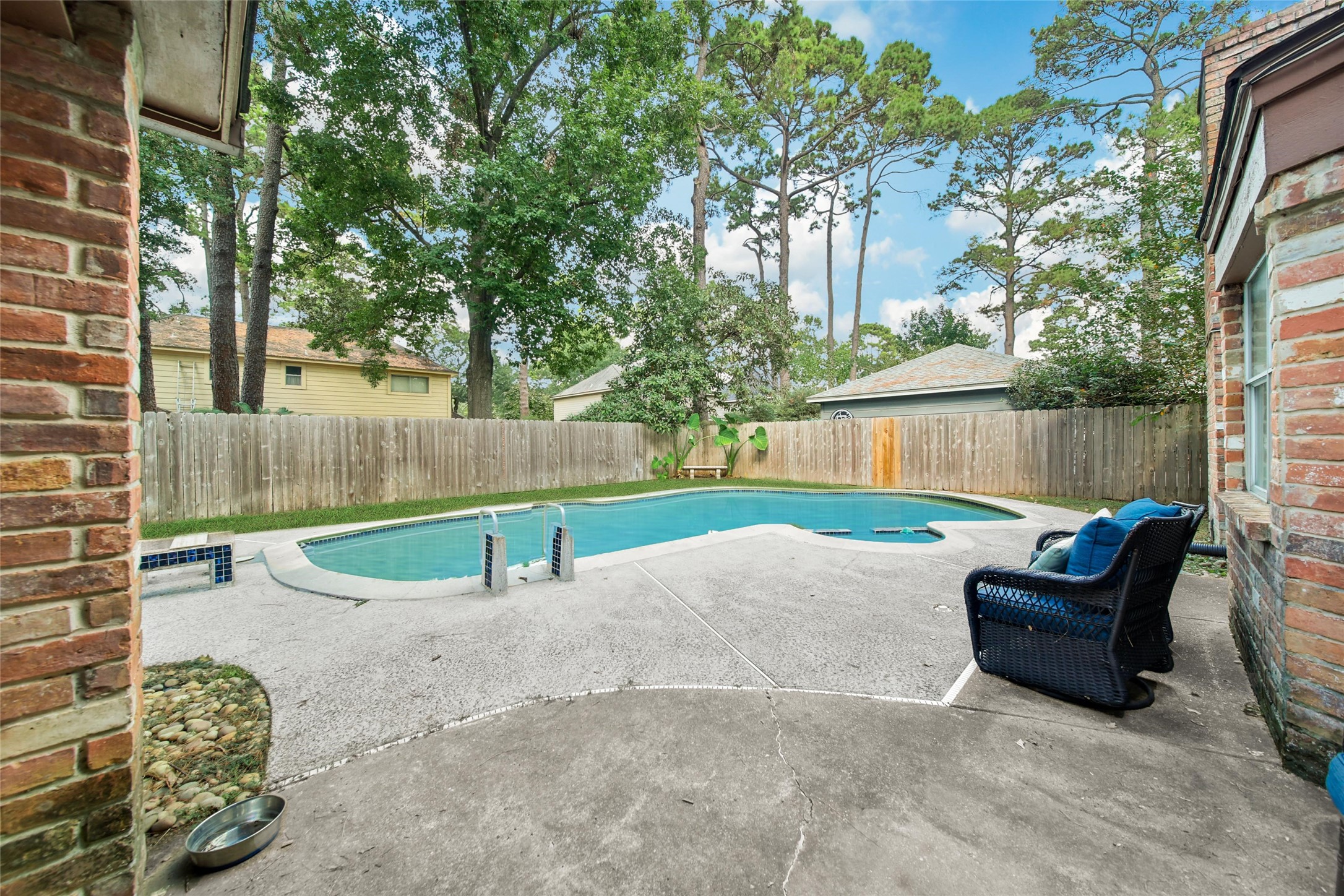 6522 Castle Pine Lane Spring, TX 77379 - Photo 37 of 38 a view of backyard with swimming pool and sitting area