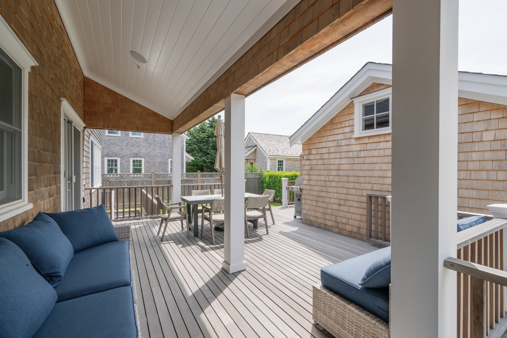 86 Cliff Road Nantucket, MA 02554 - Photo 26 of 29 a balcony with furniture and wooden floor