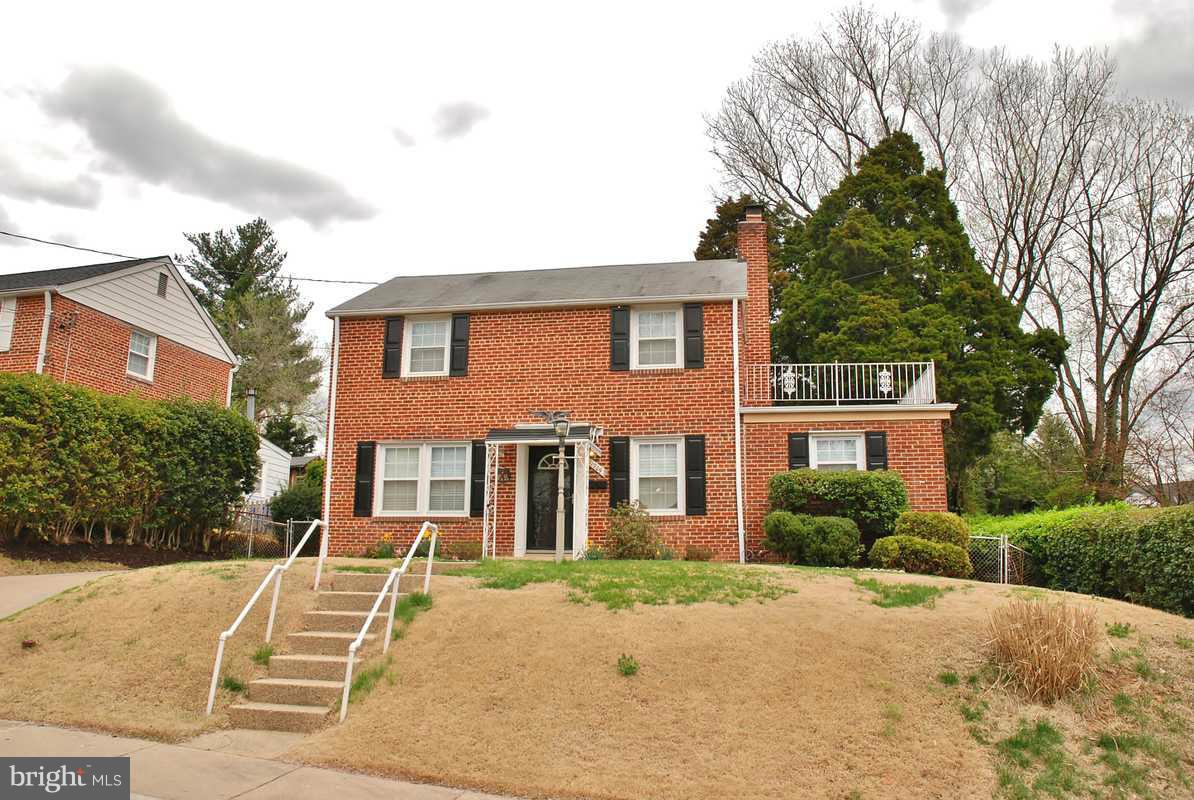 11709 Lytle Street Silver Spring, MD 20902 - Photo 22 of 24 front view of a house with a yard
