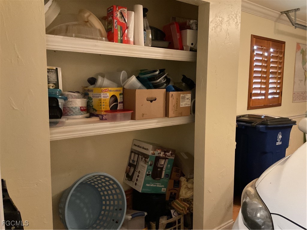 1002 Michael Avenue Lehigh Acres, FL 33936 - Photo 16 of 34 a room with storage and utility