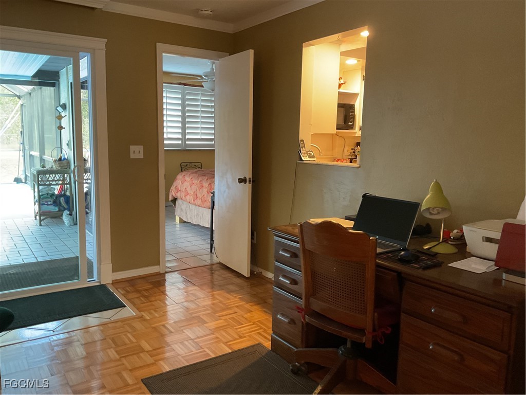 1002 Michael Avenue Lehigh Acres, FL 33936 - Photo 20 of 34 a workspace with furniture and window