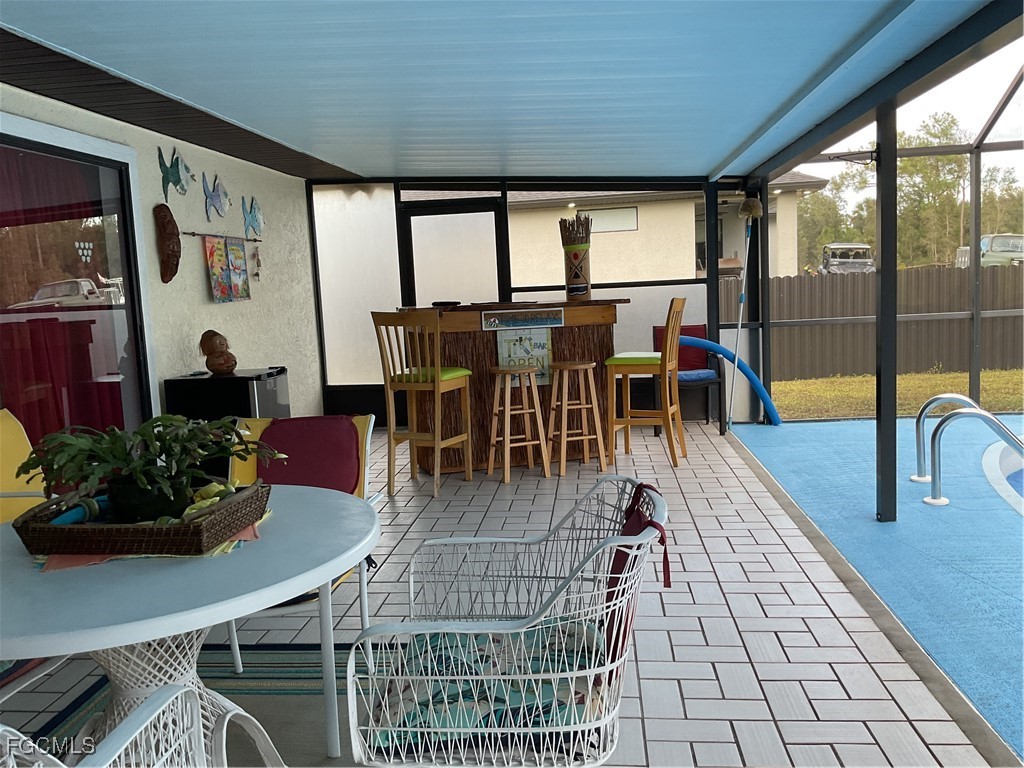 1002 Michael Avenue Lehigh Acres, FL 33936 - Photo 22 of 34 a view of a dining room with furniture window and outside view