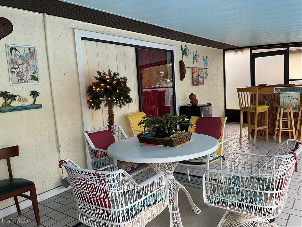 1002 Michael Avenue Lehigh Acres, FL 33936 - Photo 23 of 34 a dining room with furniture and window