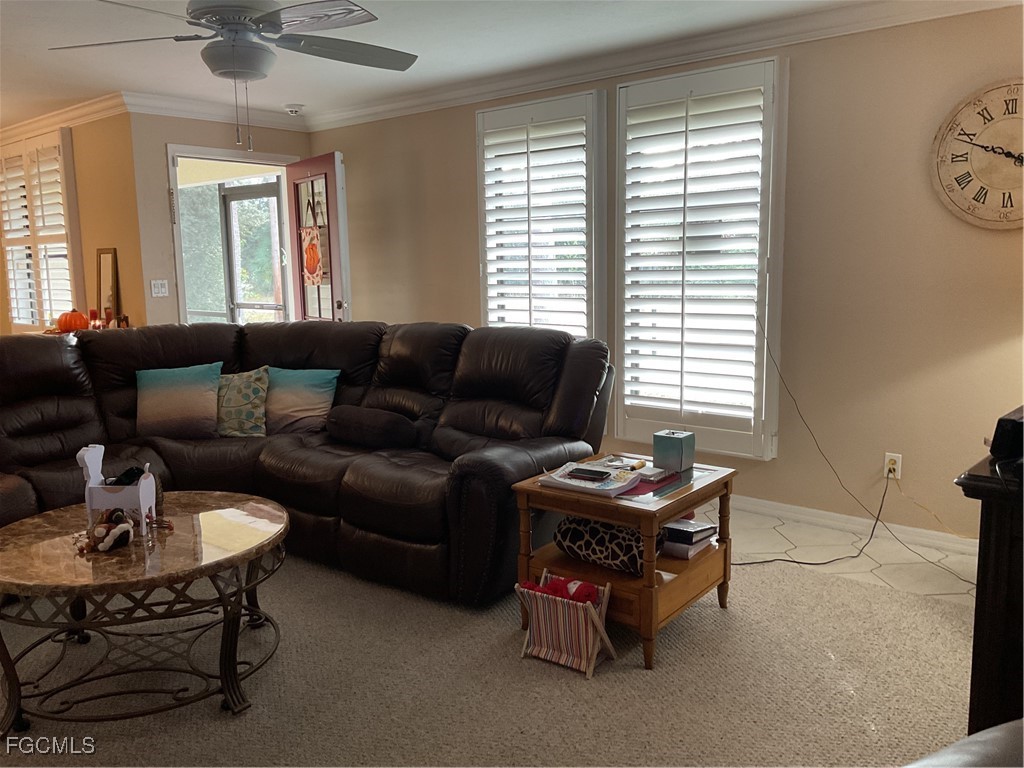 1002 Michael Avenue Lehigh Acres, FL 33936 - Photo 32 of 34 a living room with furniture and a window