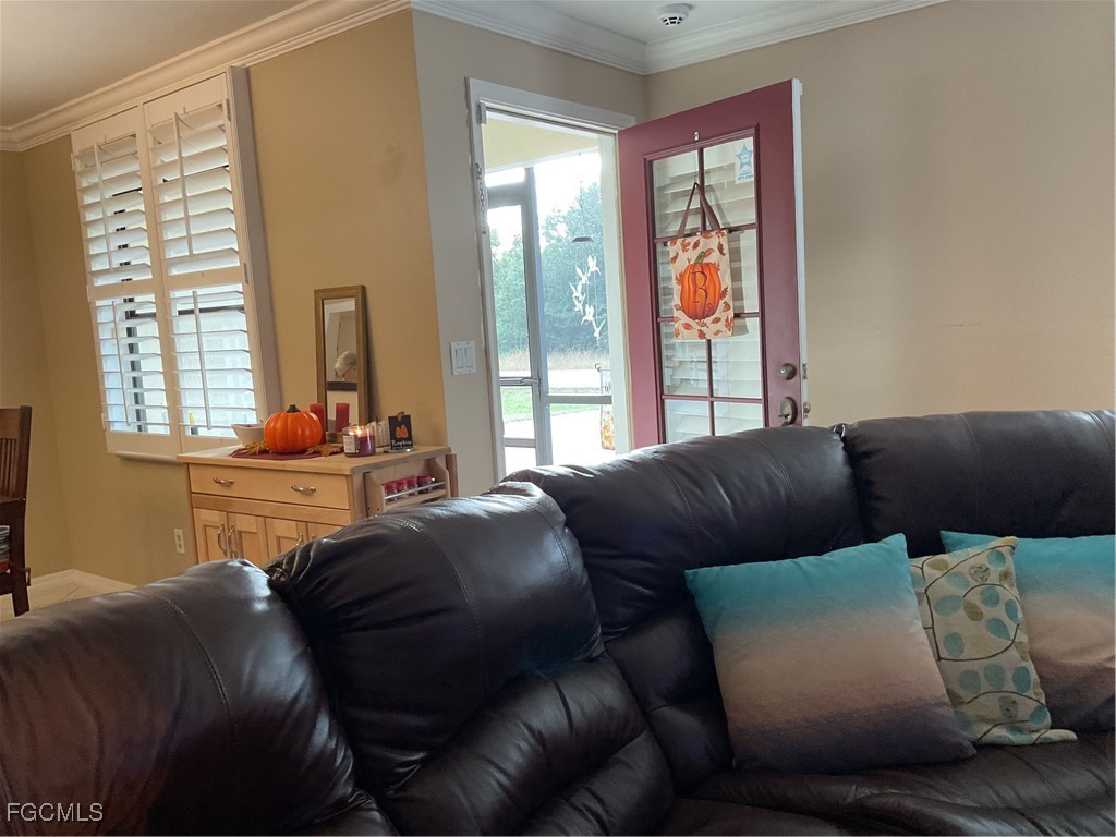1002 Michael Avenue Lehigh Acres, FL 33936 - Photo 34 of 34 a living room with furniture and a window