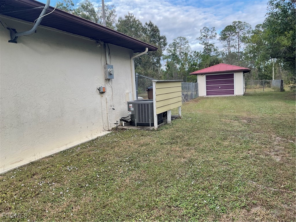1002 Michael Avenue Lehigh Acres, FL 33936 - Photo 4 of 34 a view of a backyard