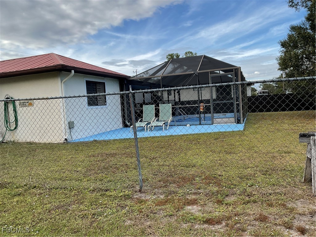 1002 Michael Avenue Lehigh Acres, FL 33936 - Photo 6 of 34 a view of a house with a slide