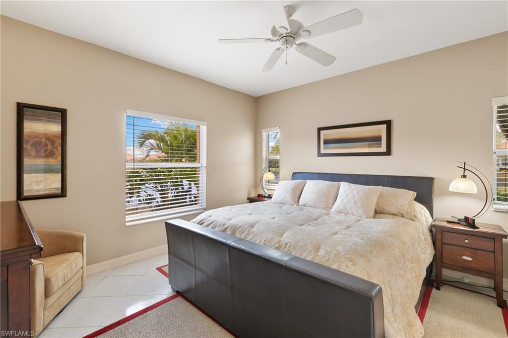 8140 Chancel Court, Unit 2 Naples, FL 34104 - Photo 12 of 39 Bedroom featuring a ceiling fan and baseboards