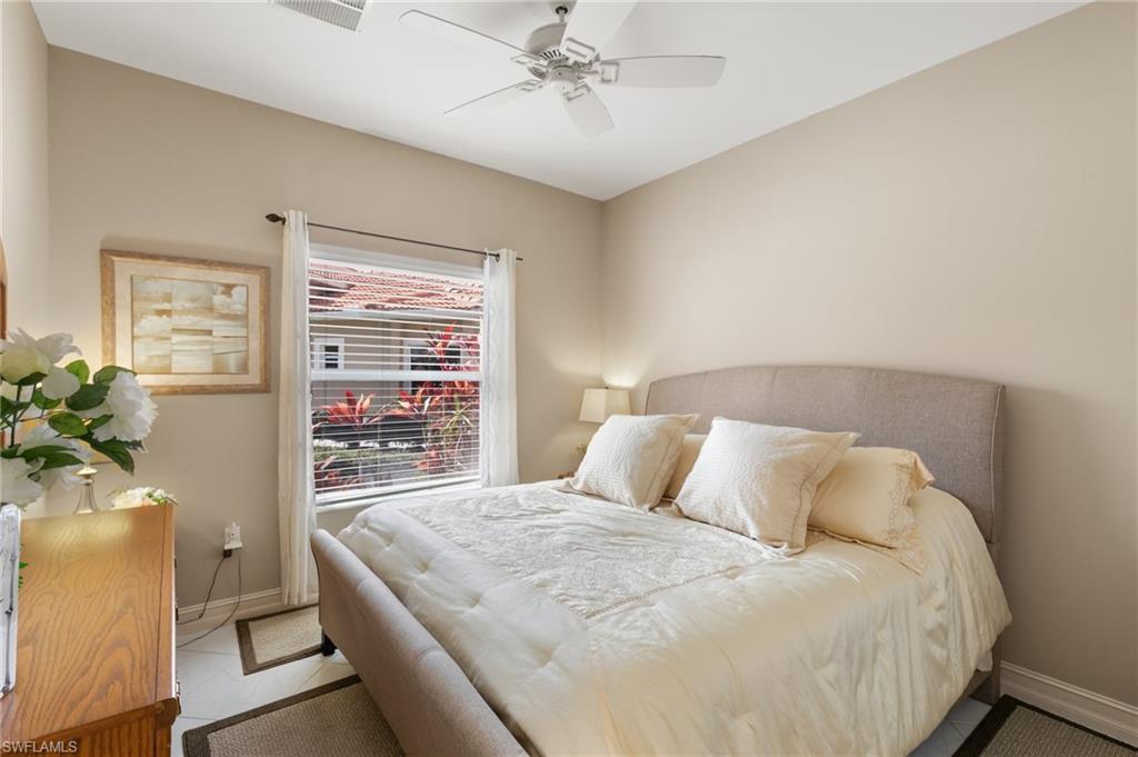 8140 Chancel Court, Unit 2 Naples, FL 34104 - Photo 17 of 39 Bedroom featuring baseboards and a ceiling fan