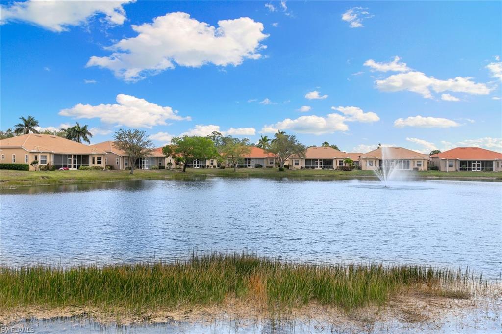 8140 Chancel Court, Unit 2 Naples, FL 34104 - Photo 23 of 39 Water view with nearby suburban area