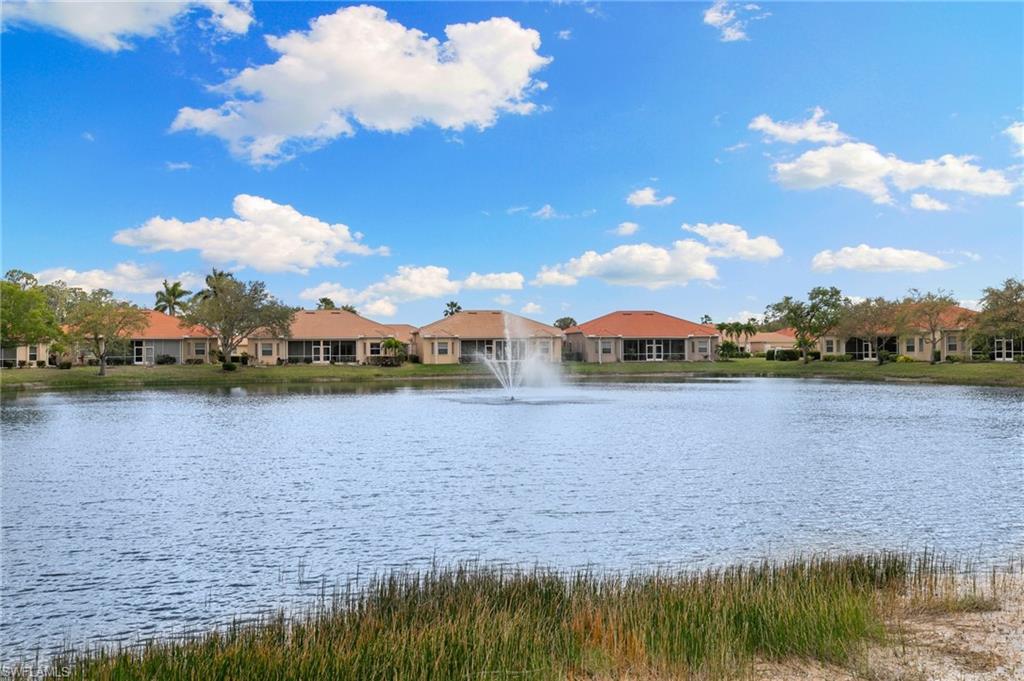 8140 Chancel Court, Unit 2 Naples, FL 34104 - Photo 25 of 39 Water view with nearby suburban area
