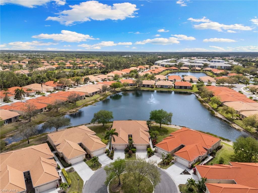 8140 Chancel Court, Unit 2 Naples, FL 34104 - Photo 30 of 39 Aerial view of residential area featuring a large body of water