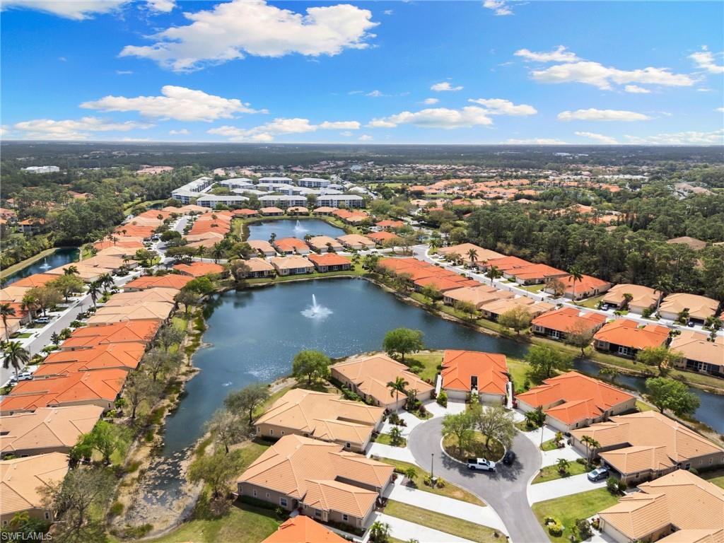 8140 Chancel Court, Unit 2 Naples, FL 34104 - Photo 32 of 39 Aerial perspective of suburban area with a nearby body of water