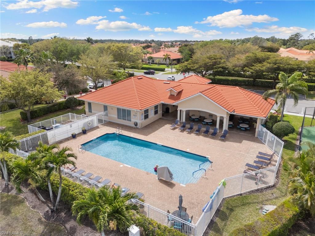 8140 Chancel Court, Unit 2 Naples, FL 34104 - Photo 36 of 39 Community pool featuring a patio and a fenced backyard