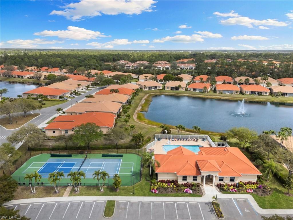 8140 Chancel Court, Unit 2 Naples, FL 34104 - Photo 37 of 39 Aerial perspective of suburban area with a large body of water