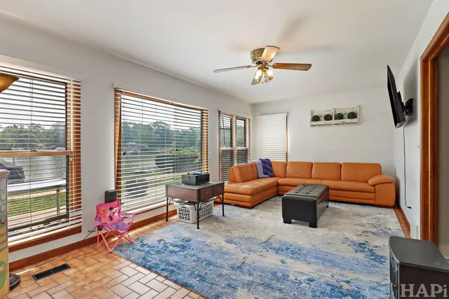 a bedroom with furniture and a window