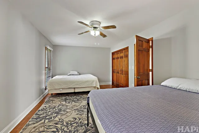 a bedroom with bed and window