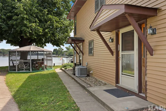 a view of a house with a yard porch and sitting area