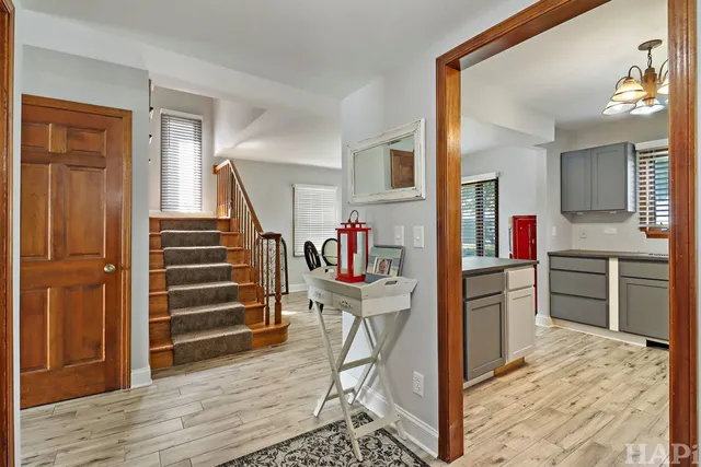 a kitchen with a refrigerator and a sink