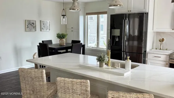 a dining room with table and chairs
