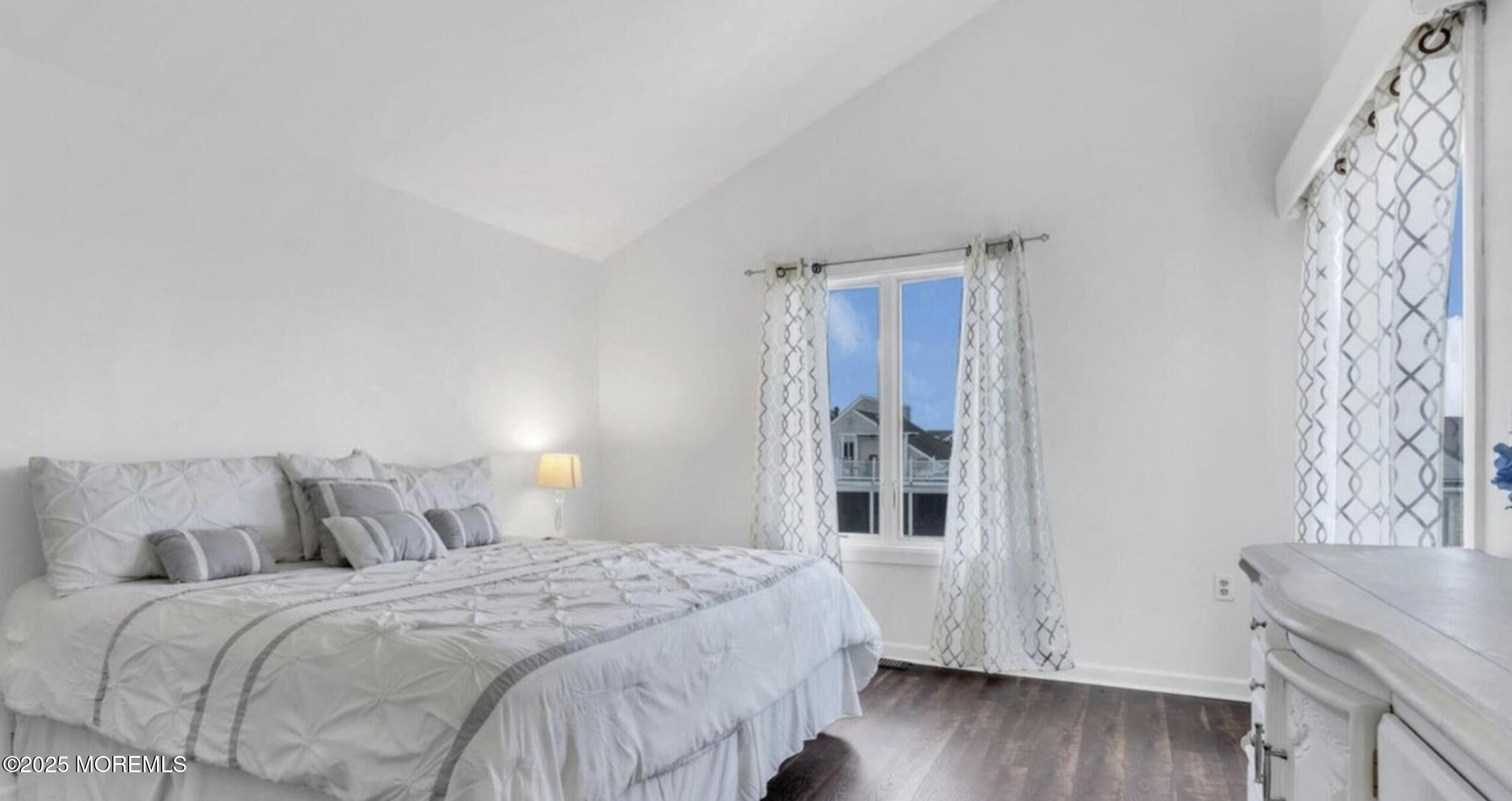 104 Catherine Lane Manahawkin, NJ 08050 - Photo 5 of 14 a bedroom with a bed and a window