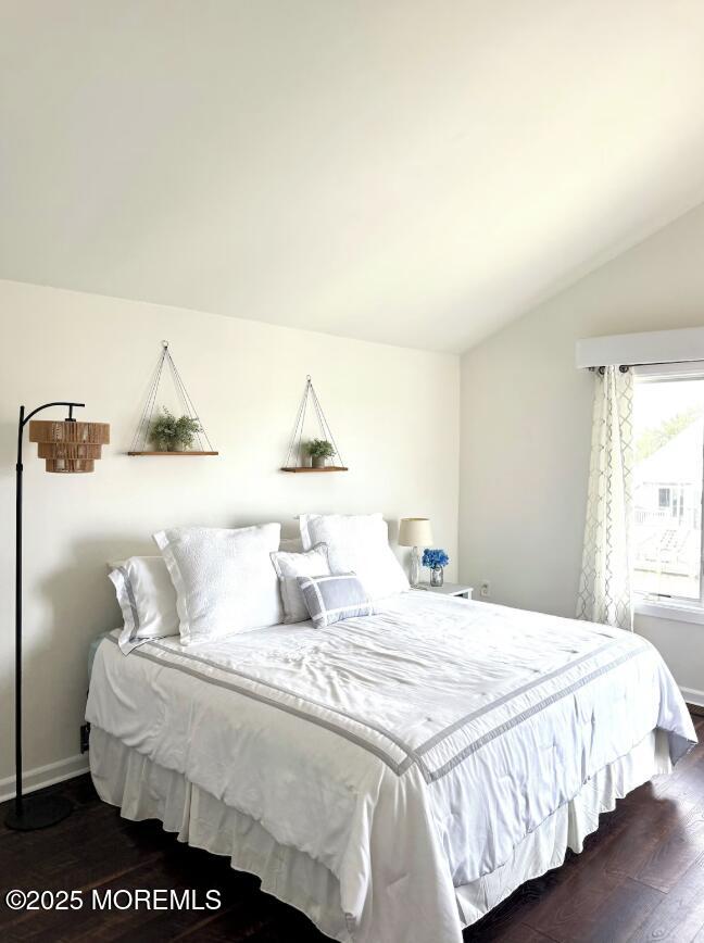 104 Catherine Lane Manahawkin, NJ 08050 - Photo 6 of 14 a bedroom with a bed and a night stand