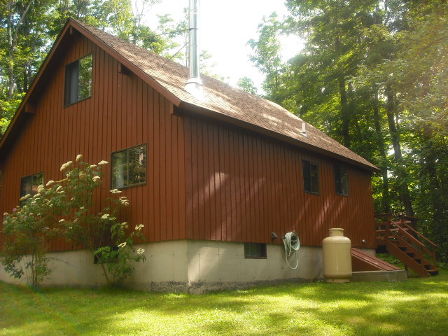 246 Stebbins Road Otis, MA 01253 - Photo 11 of 14 a backyard of a house with large trees