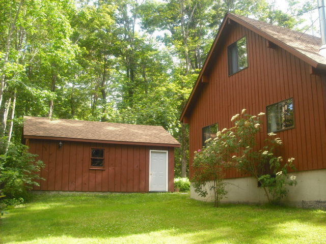 246 Stebbins Road Otis, MA 01253 - Photo 12 of 14 a backyard of a house with lots of green space