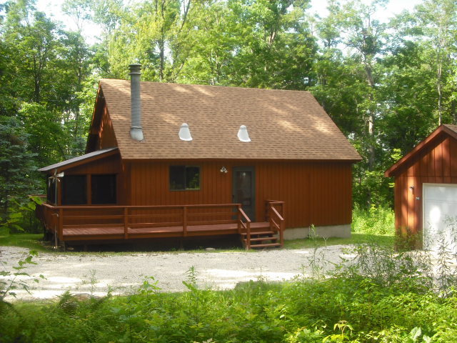 246 Stebbins Road Otis, MA 01253 - Photo 13 of 14 a view of a house with a yard