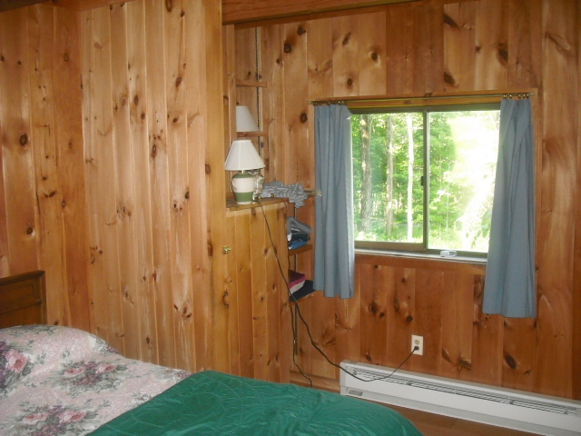 246 Stebbins Road Otis, MA 01253 - Photo 6 of 14 a bedroom with a bed and a window