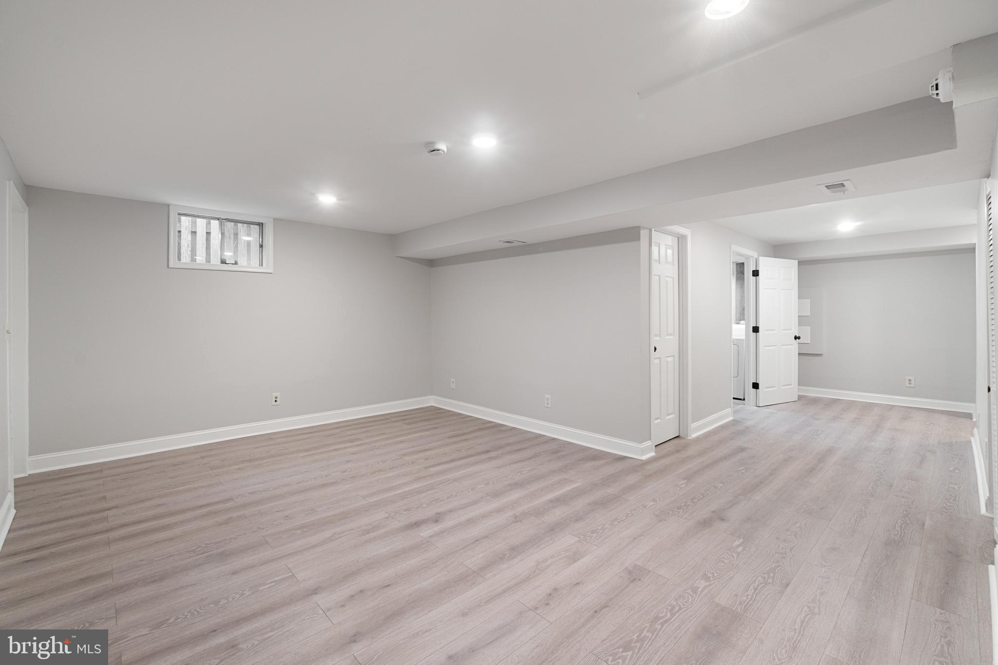 8546 Skipjack Place Pasadena, MD 21122 - Photo 14 of 20 a view of an empty room with wooden floor