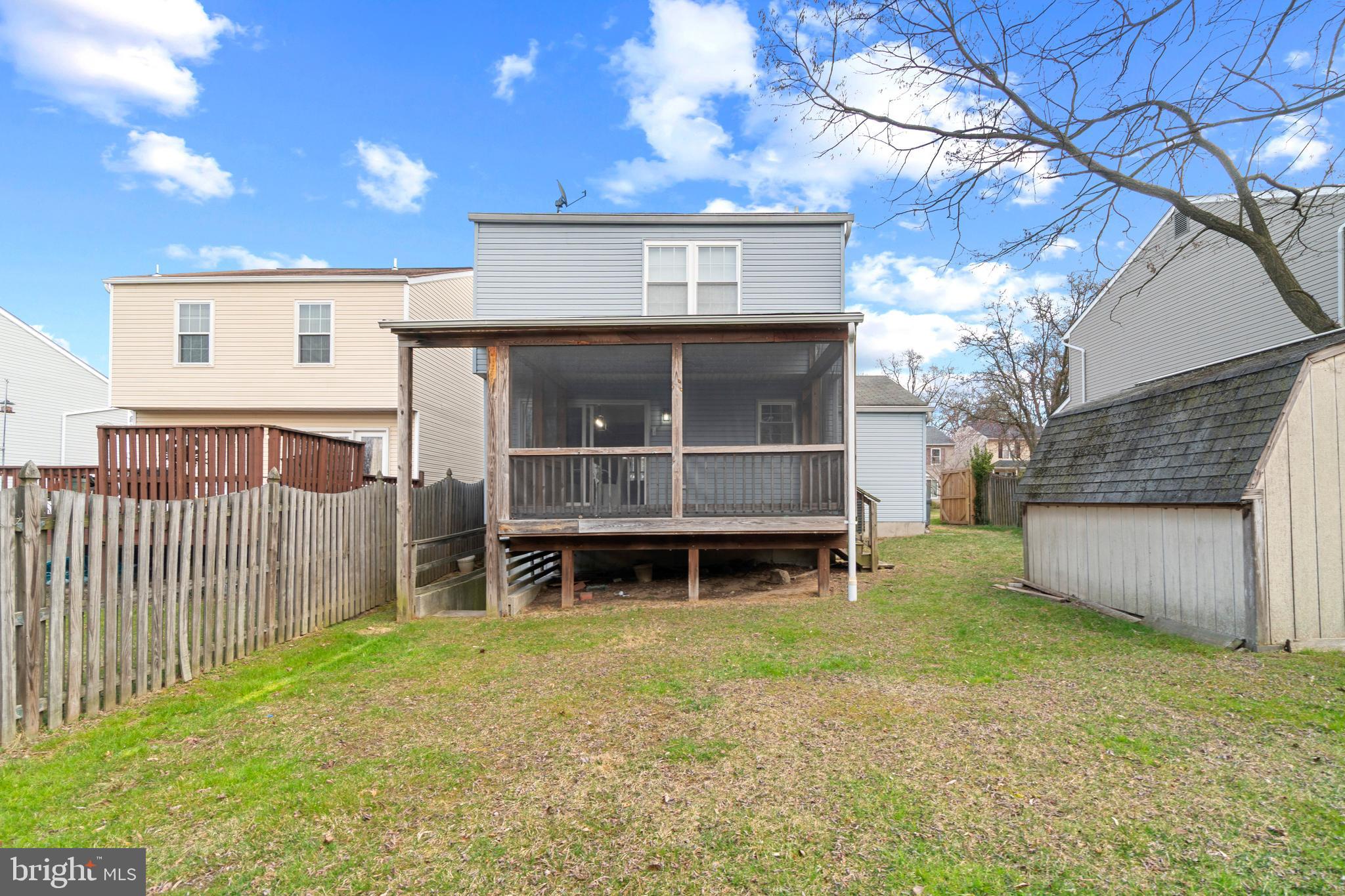 8546 Skipjack Place Pasadena, MD 21122 - Photo 17 of 20 a front view of a house with a yard
