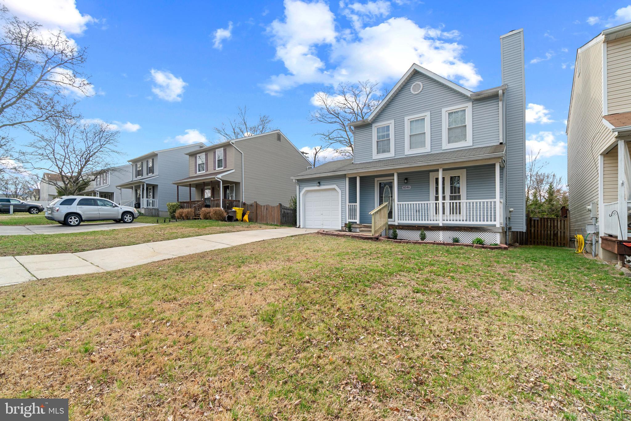 8546 Skipjack Place Pasadena, MD 21122 - Photo 18 of 20 a view of a house with a yard and sitting area