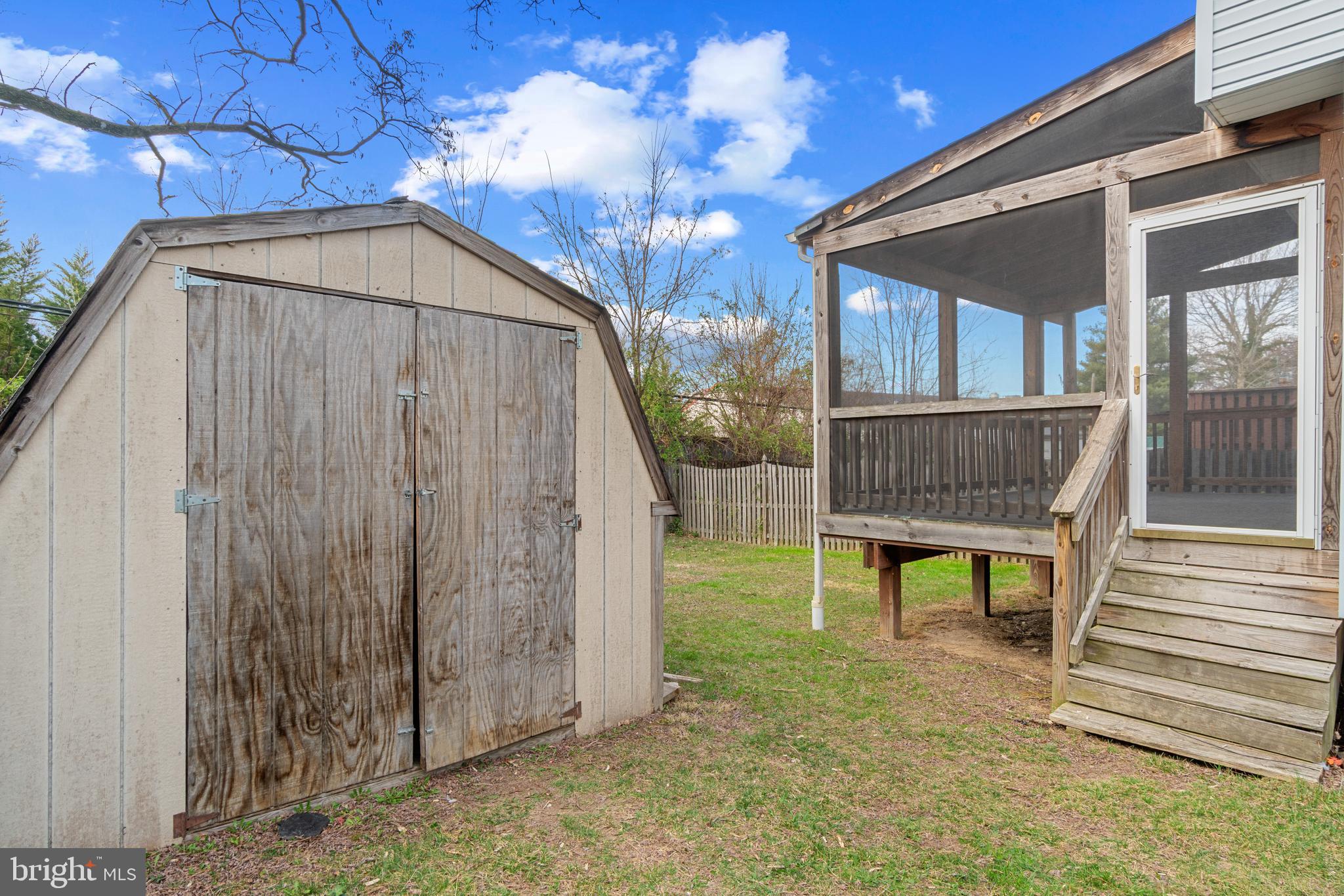 8546 Skipjack Place Pasadena, MD 21122 - Photo 20 of 20 a view of a chair and table in backyard of the house