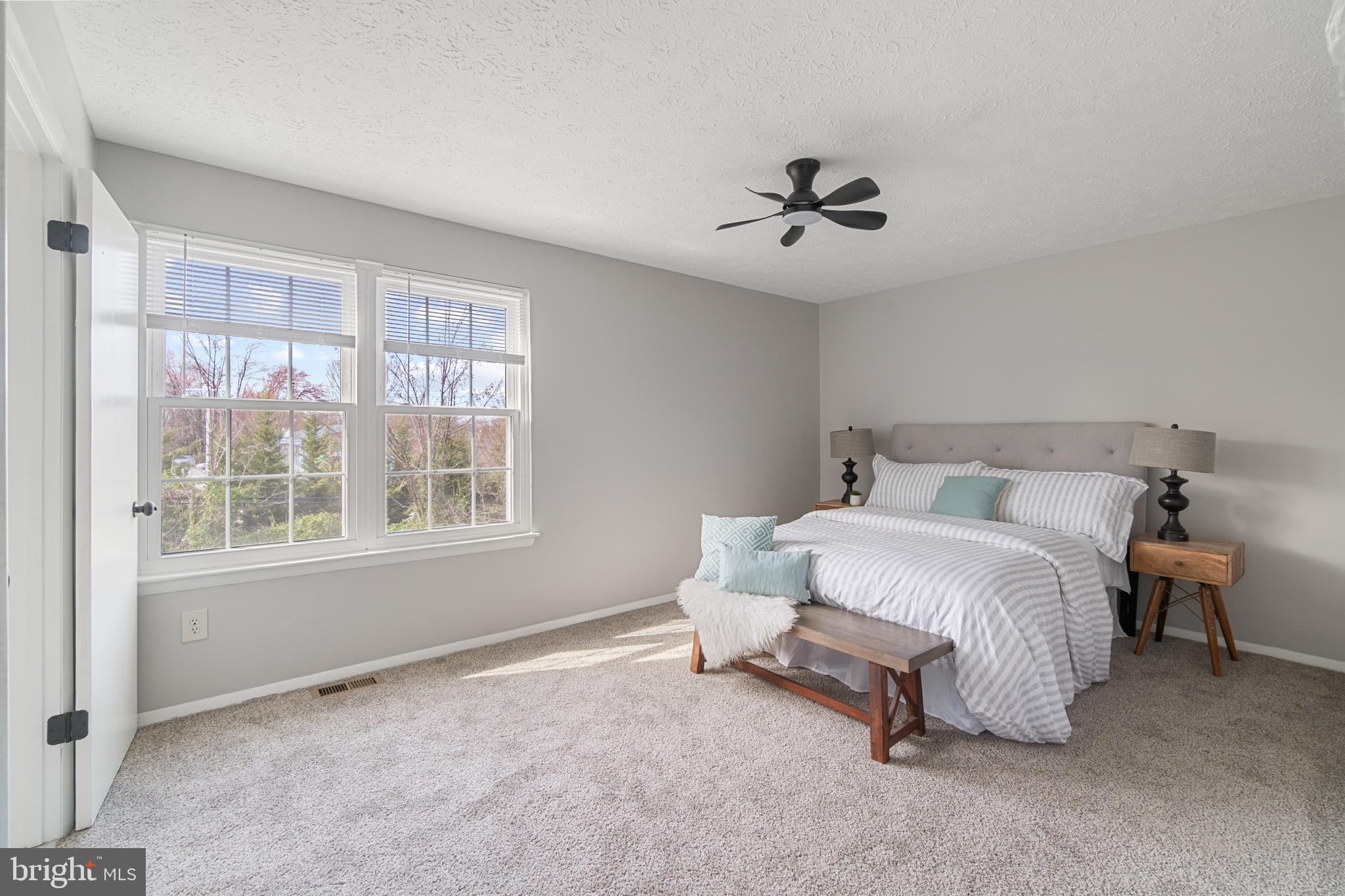 8546 Skipjack Place Pasadena, MD 21122 - Photo 7 of 20 a spacious bedroom with a bed and a window