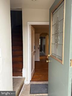 6166 Parkway Drive Baltimore, MD 21212 - Photo 2 of 9 a view of a hallway with wooden floor and a living room