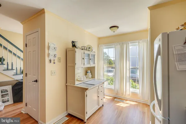 a view of living room with furniture and large window