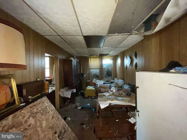 a very nice looking dining room with a large mirror and couches