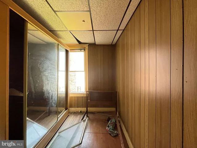 a bathroom with shower and window