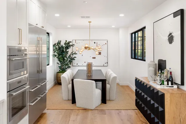 a large white bed in a white room