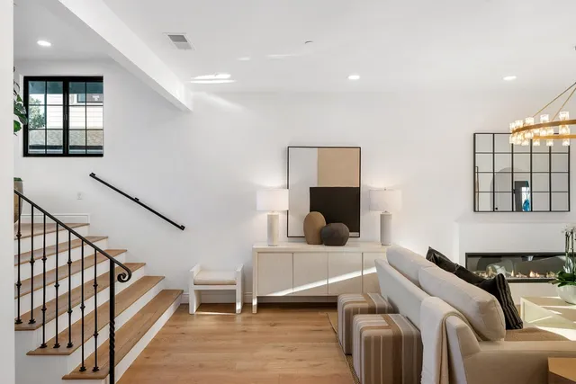 a bedroom with two beds and a window