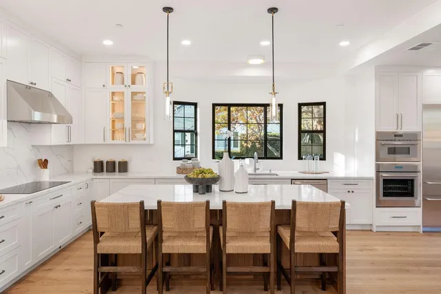 a spacious bedroom with a bed and a couch