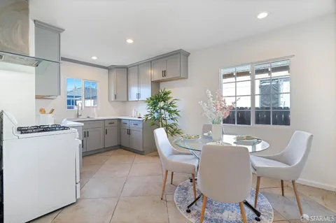 a kitchen with a sink cabinets and window