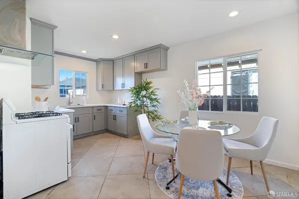 a kitchen with a sink cabinets and window