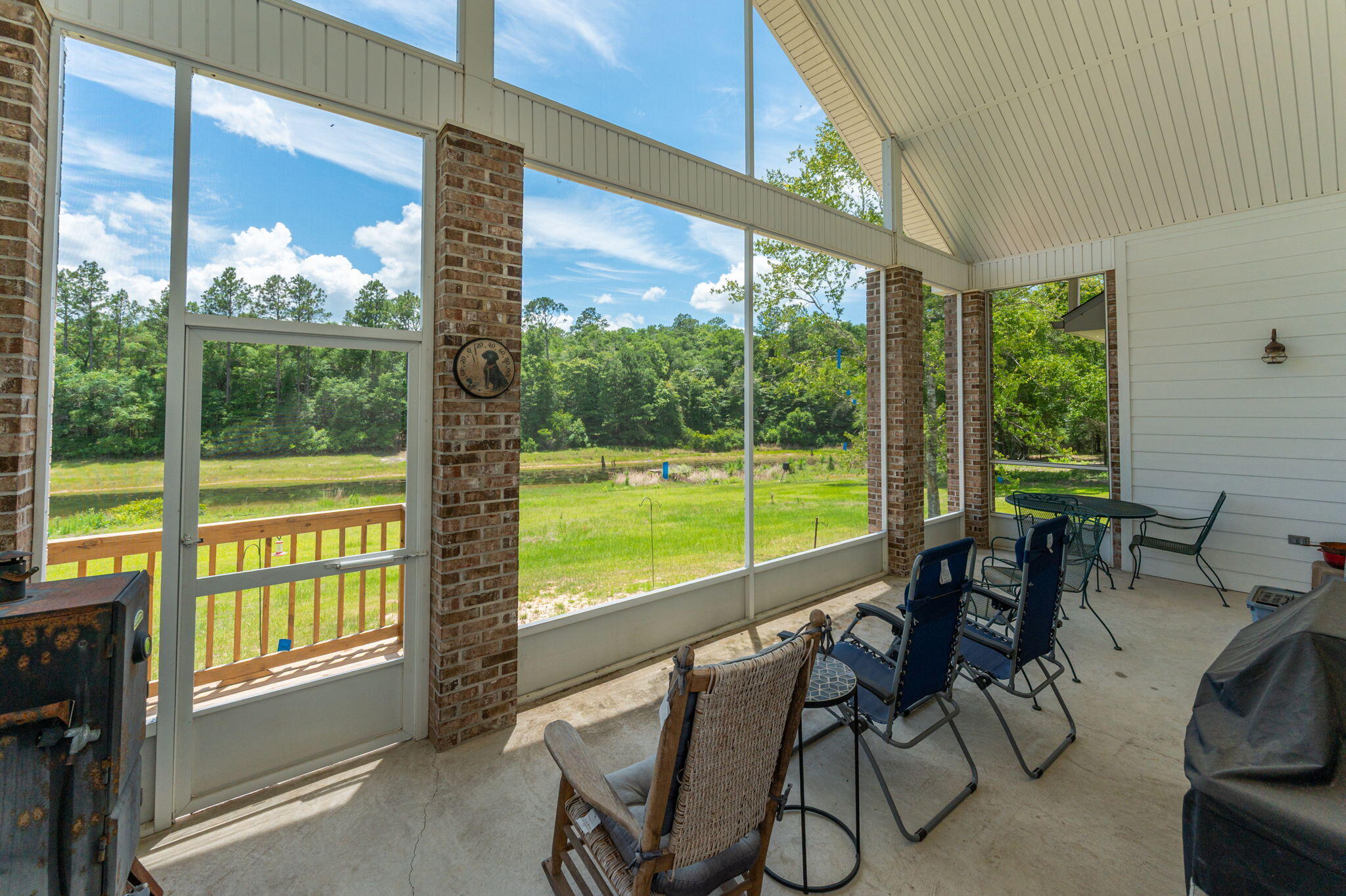 6199 Lake Ella Road Crestview, FL 32539 - Photo 40 of 58 Screened porch looks over lake