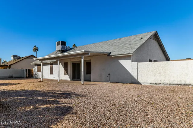 a house with trees in the background