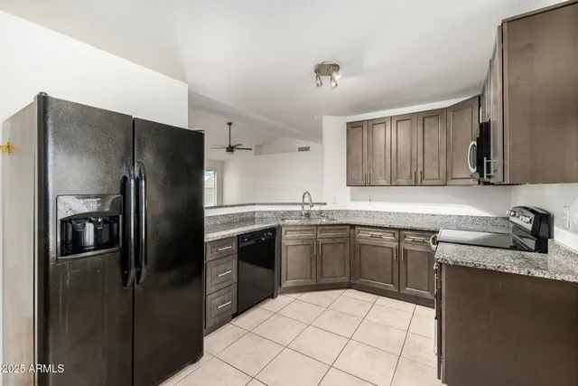 a kitchen with a sink stove and refrigerator