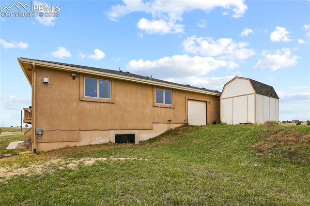 a backyard of a house with lots of green space