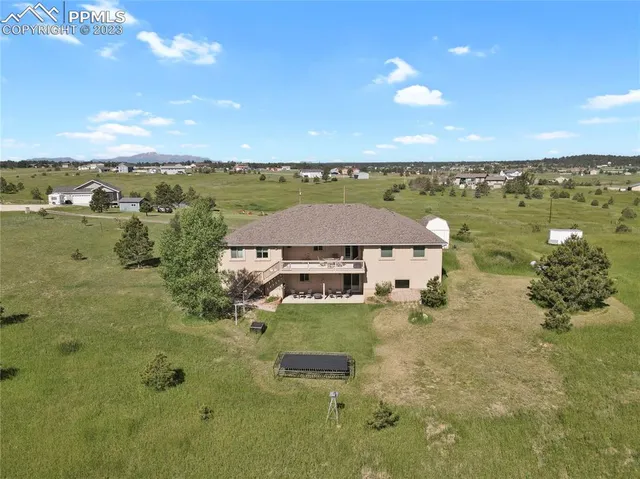 a view of a lake with a house in the background